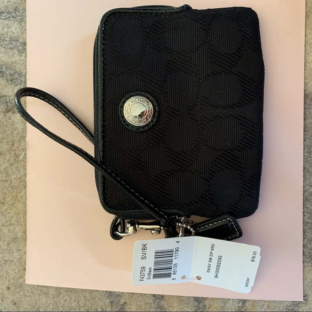 Black coach wristlet with pink accents